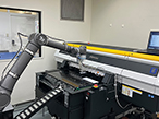 研美社、自動化ロボット連結のUVインクジェット印刷機が稼働